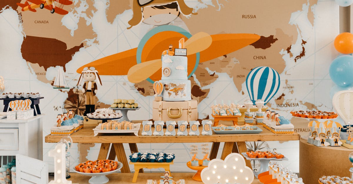 Bright colorful decorations in travel theme with cake and various sweets against map