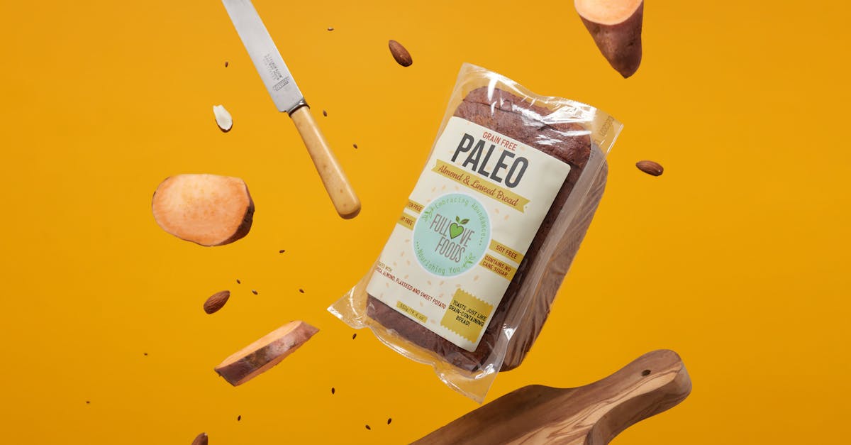 A Shot of Paleo Bread in Bag Surrounded By Cutting Board, Knife and Pieces of Food