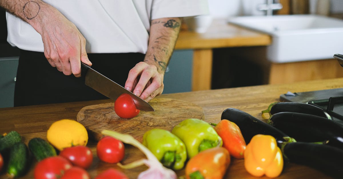 Man Cutting a Tomato