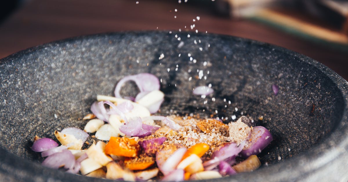 Person Pouring Salt in Bowl