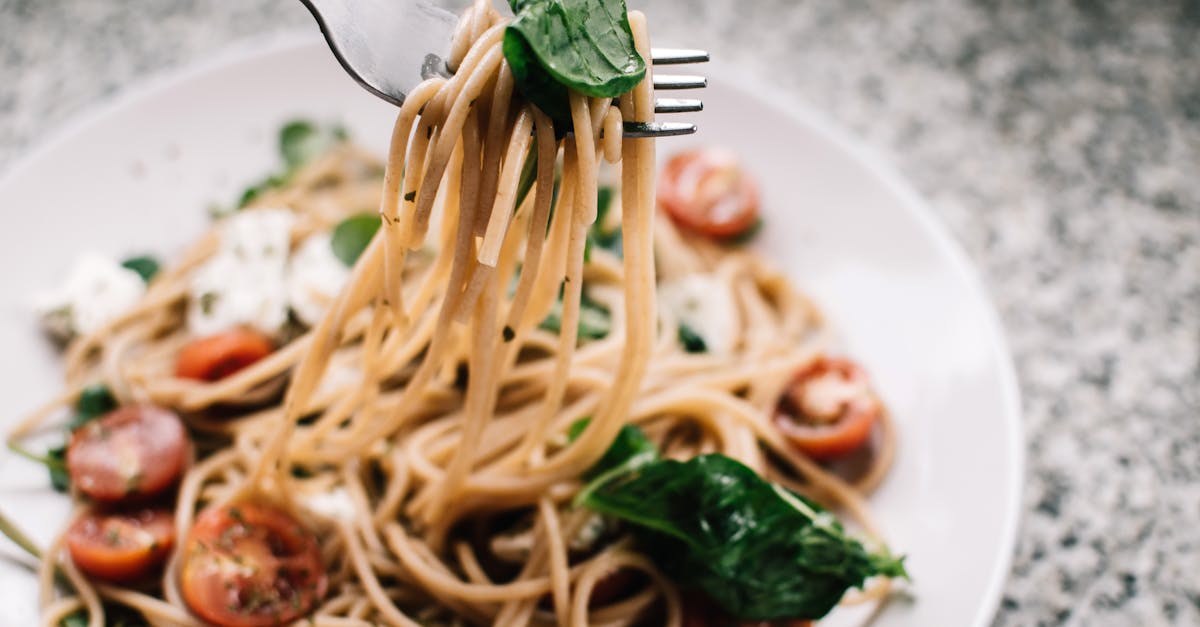 Selective Focus Photography of Pasta With Tomato and Basil