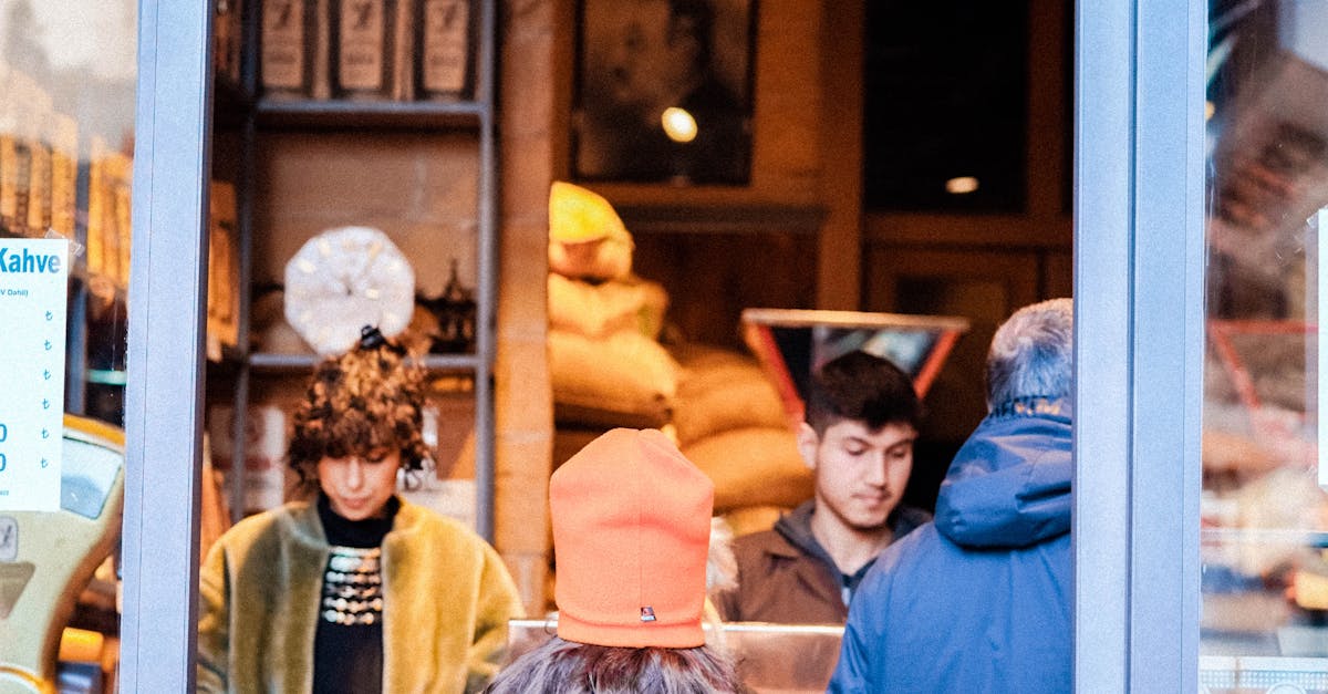 A man and woman standing in front of a store