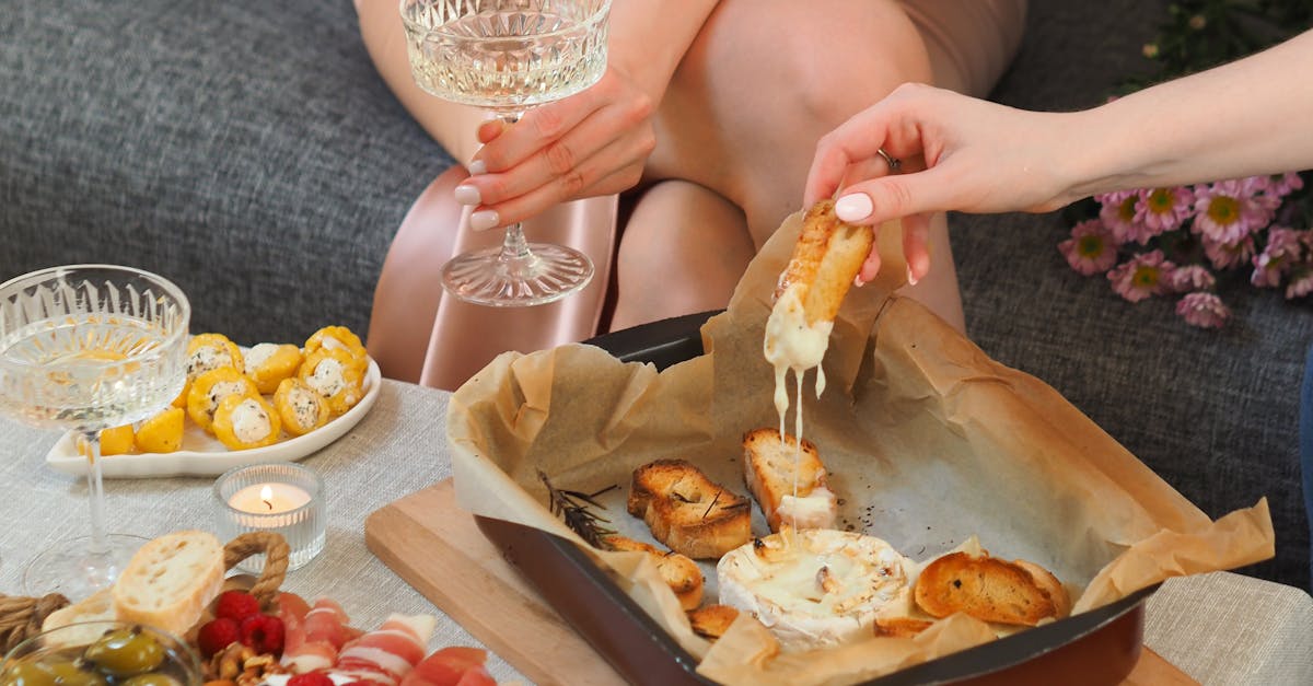 Women Drinking Champagne and Eating Garlic Bread