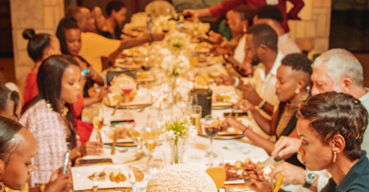 Family Sitting Together by Table