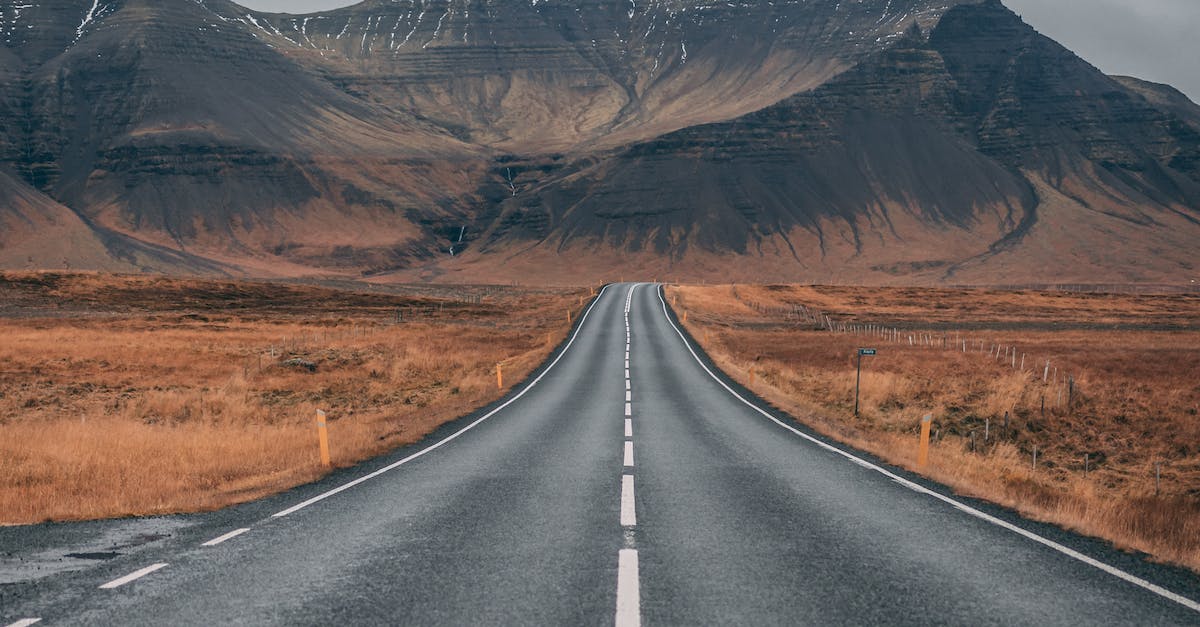 Empty Highway Overlooking Mountain Under Dark Skies