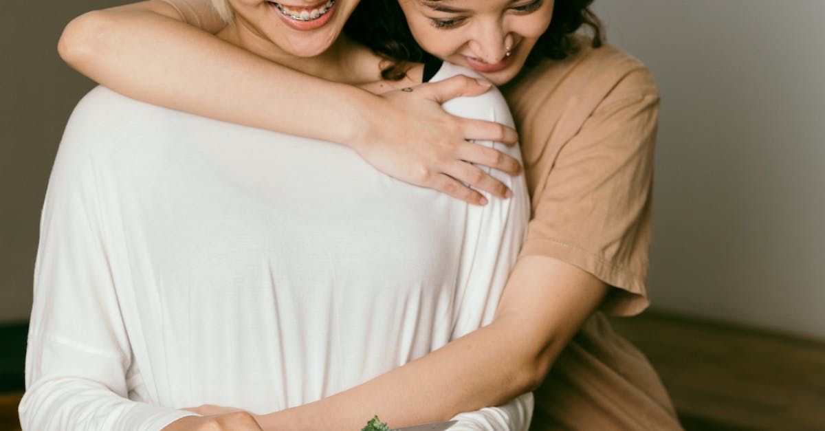 Woman Being Hugged While Making Dinner