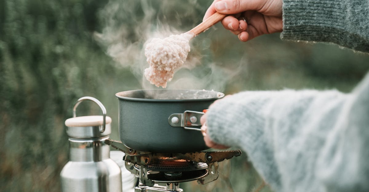 A Person Cooking Oatmeal using Portable Stove