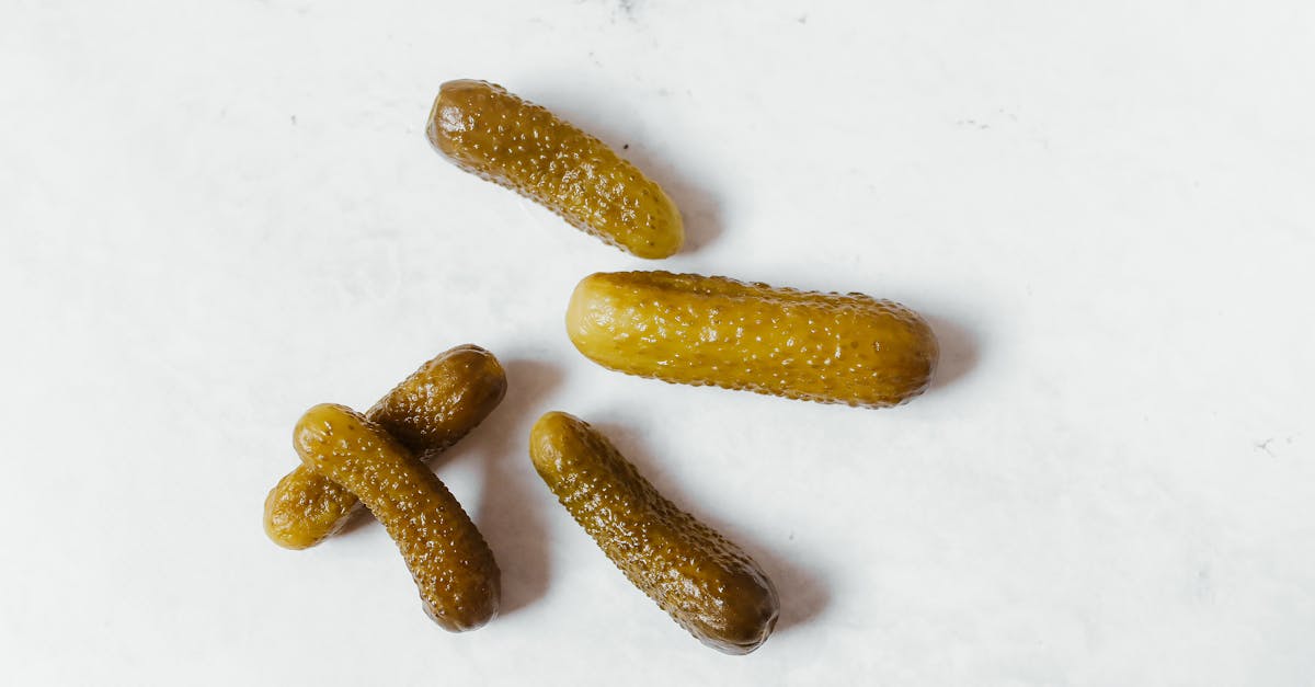 Cucumber Pickles on White Surface