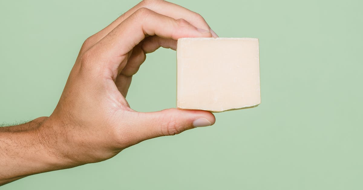 Person Holding White Square Paper