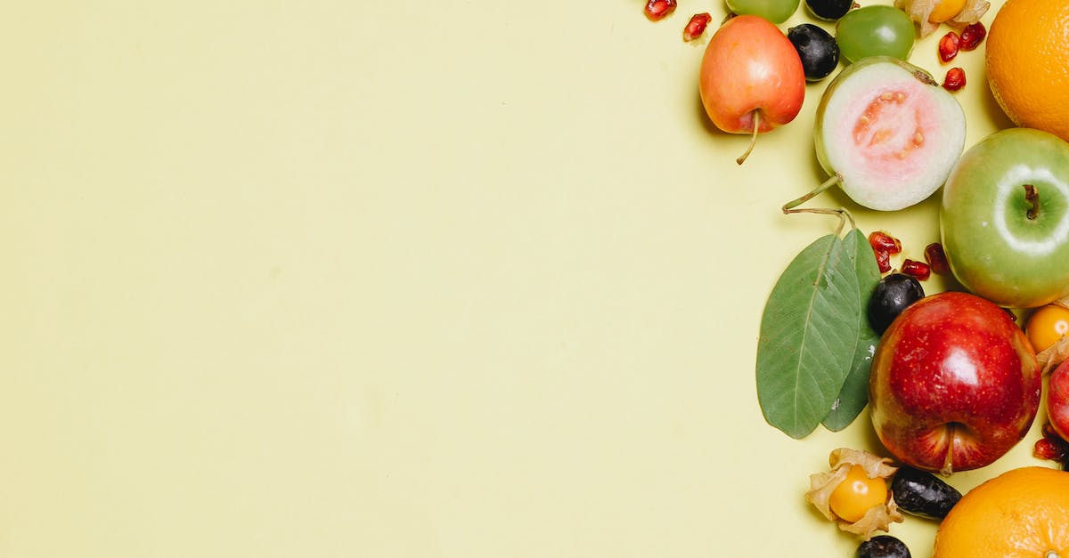 Ripe fresh fruits on beige surface